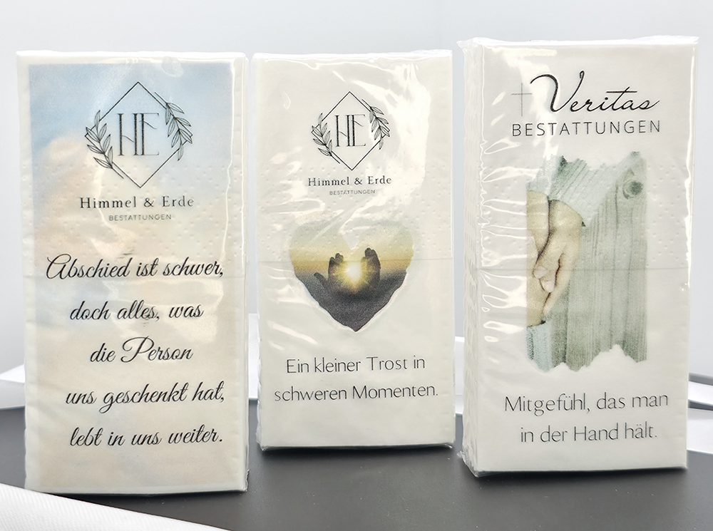 Drei Packungen Trauer-Taschentücher mit Trostmotiven